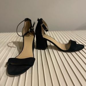 Black suede sandals with 2 1/2 “ heels and ankle strap. Size 10